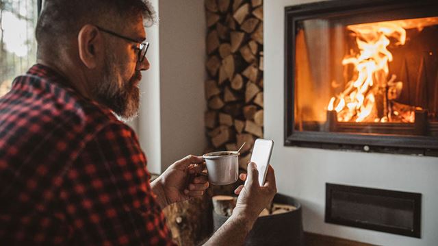 Switch energy suppliers man fireplace phone